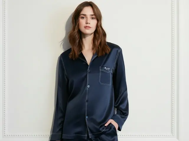 Woman wearing navy silk pyjamas