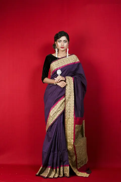 Woman in a red and brown silk cotton saree